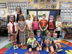 Ravalli County CU's Laci Rose teaching 1st graders about finances